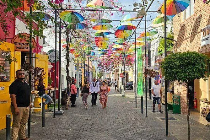 Colorful umbrellas hanging over Umbrella Street in historic downtown Puerto Plata