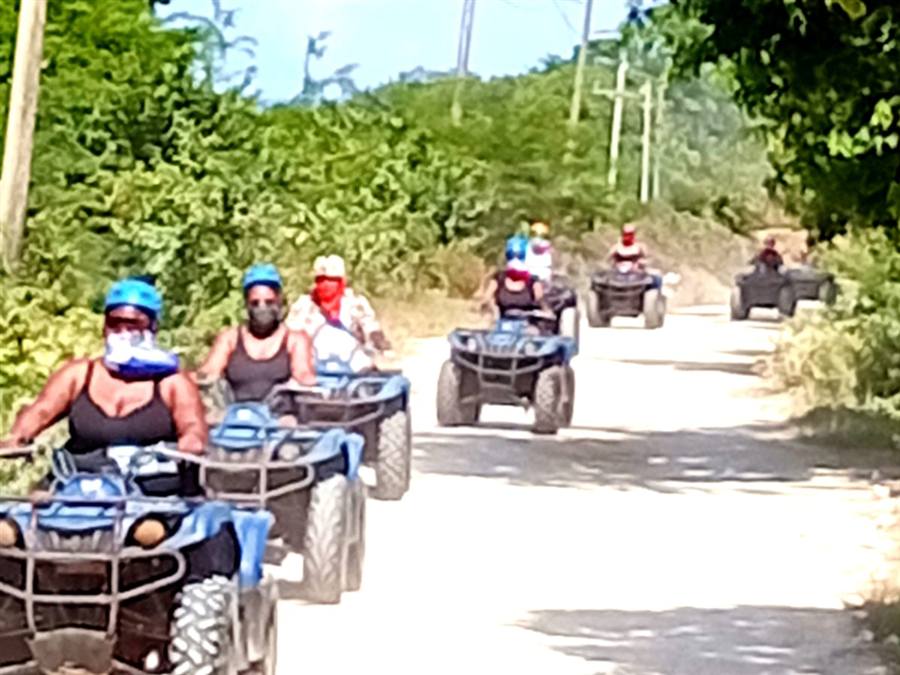 Group of ATV riders on a countryside excursion